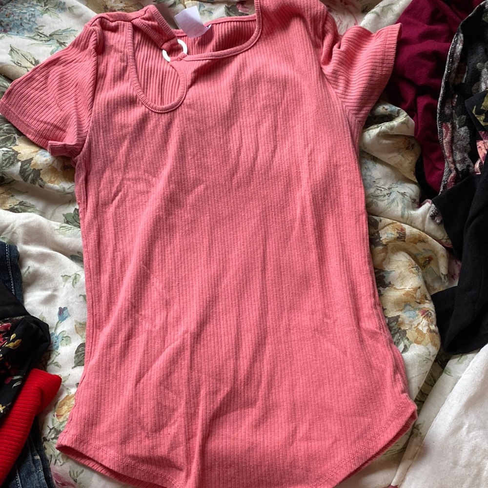 A pink short sleeve shirt